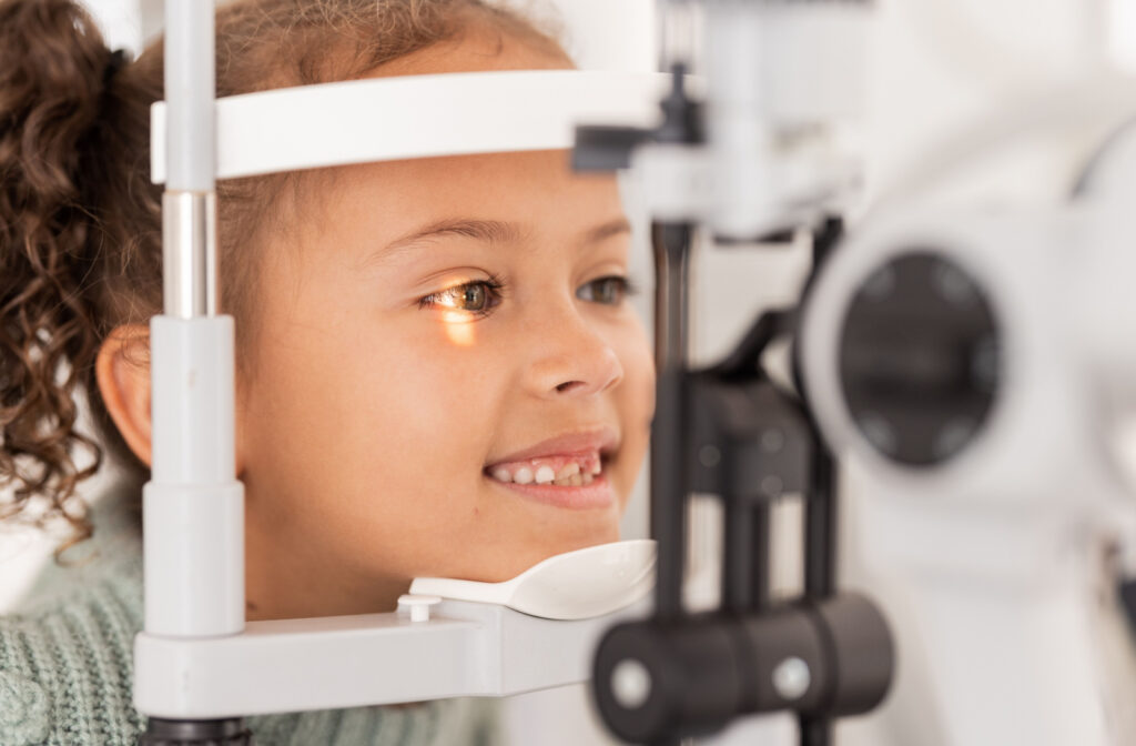 A child having their eyes examined during a kids eye exam.