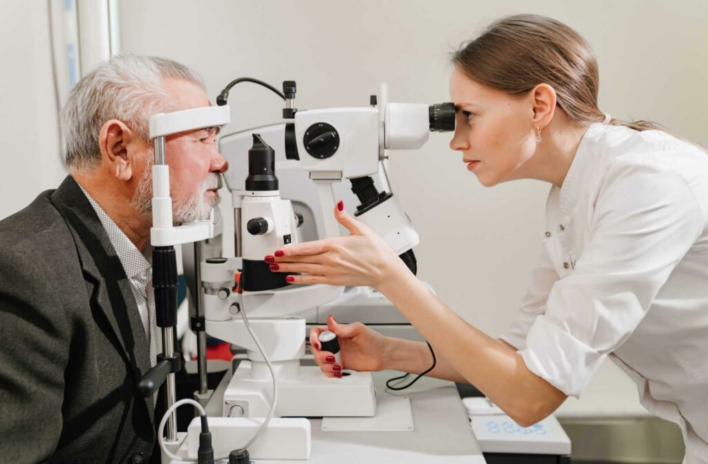 An optometrist assessing a patient's eyes during an eye exam.